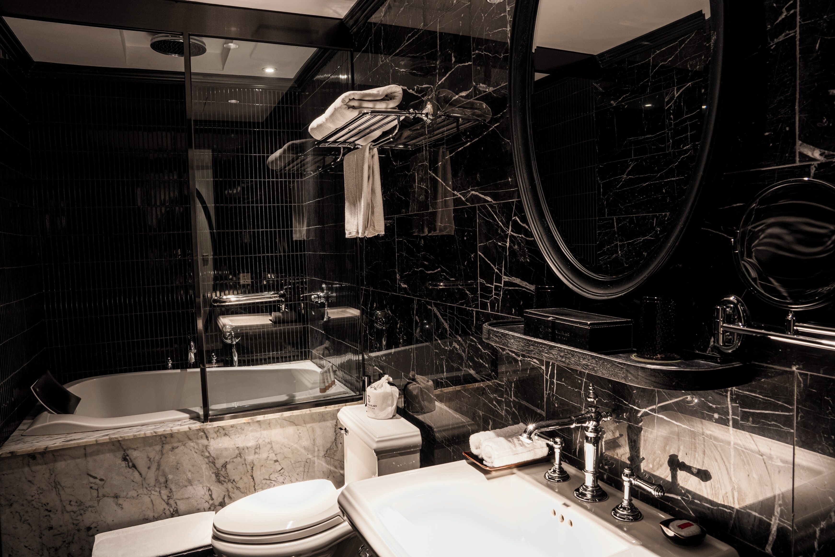 superior basement room | bathroom | rainfall showerhead, free toiletries, hair dryer, bathrobes