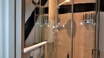 Combined shower/bathtub, hair dryer, towels, soap