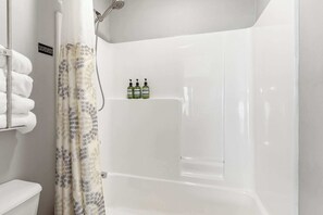 Shower, hair dryer, towels, shampoo