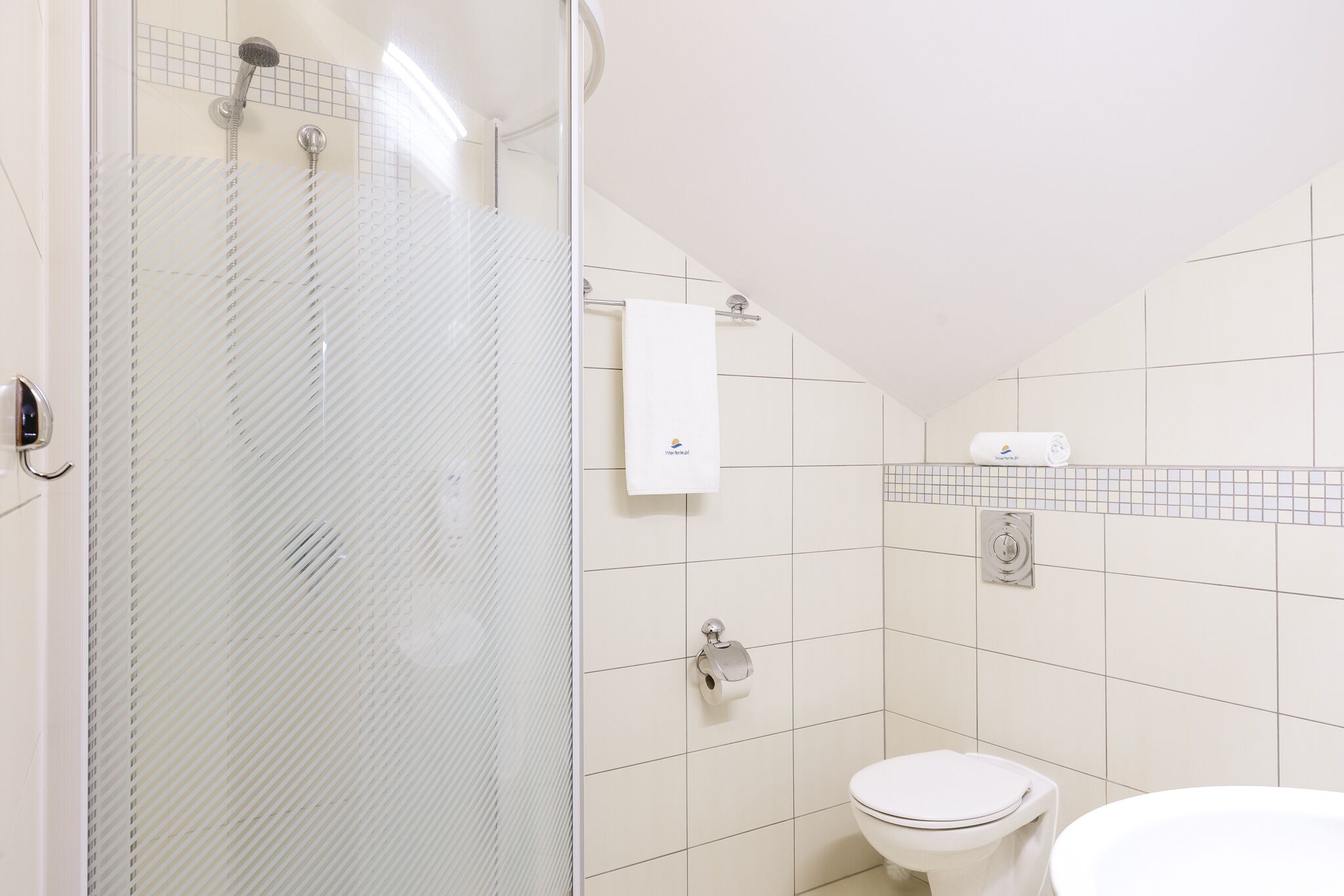 studio | bathroom | shower, rainfall showerhead, towels, soap