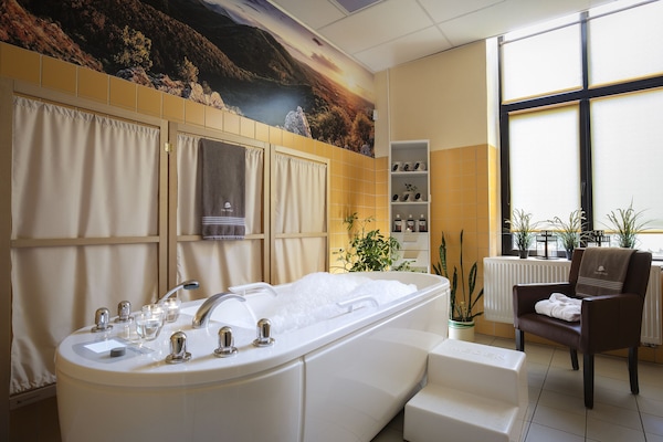Shower, rainfall showerhead, towels, soap