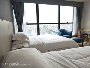 Deluxe Twin Room (8th to 22nd Floor) | Desk, blackout curtains, iron/ironing board, free WiFi - The Passion Man Hotel (Zhongshan)