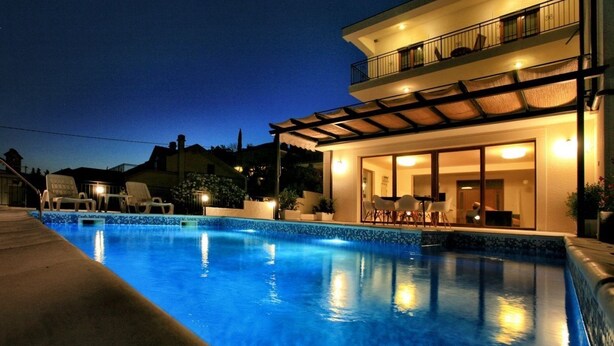 A modern two-story house with a swimming pool, outdoor seating, and a well-lit balcony. - Villa 22 ,beautiful villa with a gorgeous view on Boka bay (Herceg Novi)