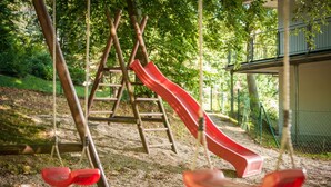 A playground with a slide and swings. - Apartment WE 9 Dog allowed! - Apartments at the sports field (Sellin)