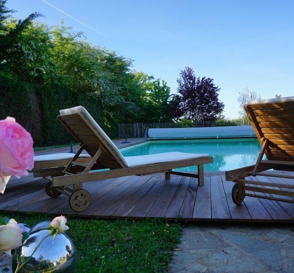 Outdoor pool, pool umbrellas, pool loungers