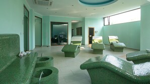 A spa room with green tiled furniture, a large window, and a ceiling light fixture. - Perla Sun Park Hotel (Primorsko)