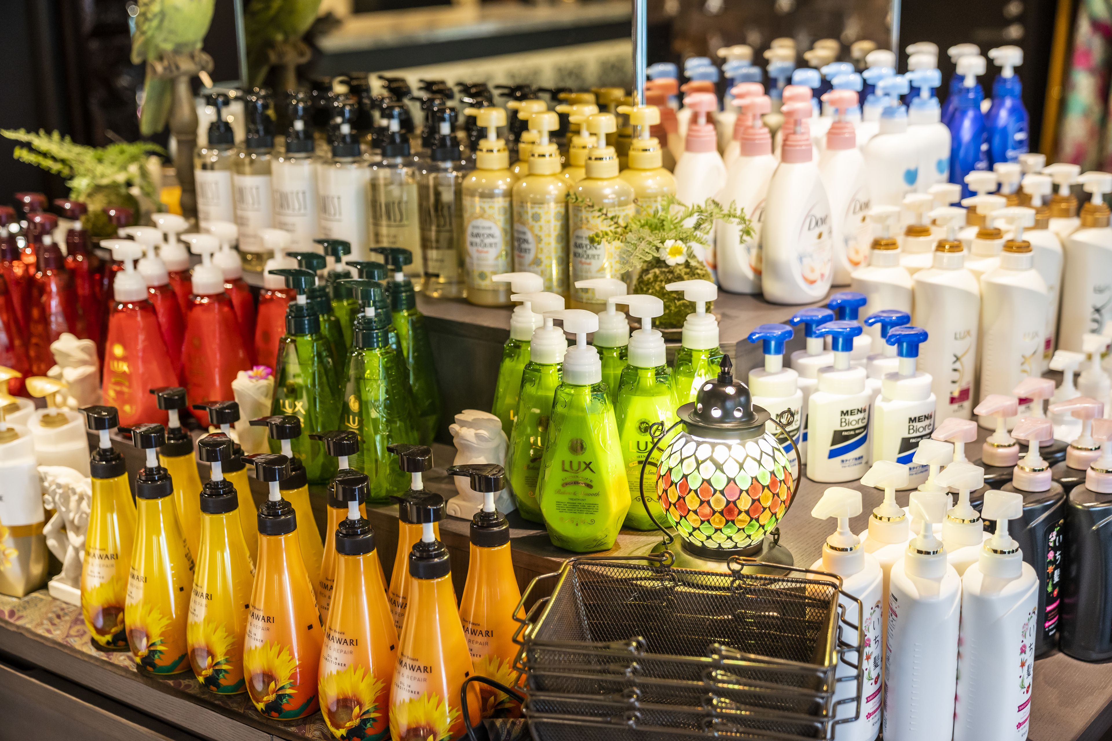 A variety of personal care products on display, including bottles and containers of different sizes and colors.