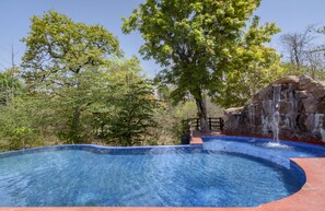 Outdoor pool, pool umbrellas, sun loungers