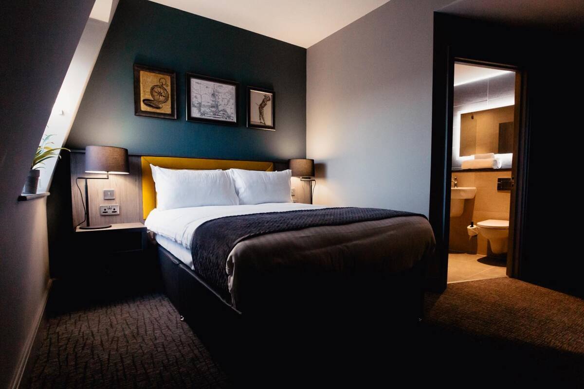 standard double room | in-room safe, individually decorated, desk, laptop workspace