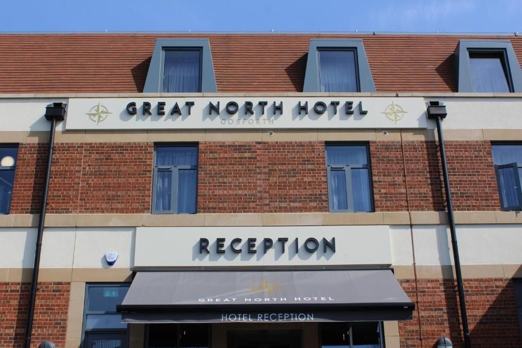The Great North Hotel reception with a clear sign above the entrance.