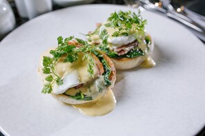 A plate with two poached eggs, spinach, and hollandaise sauce. - Great North Hotel (Newcastle-upon-Tyne)