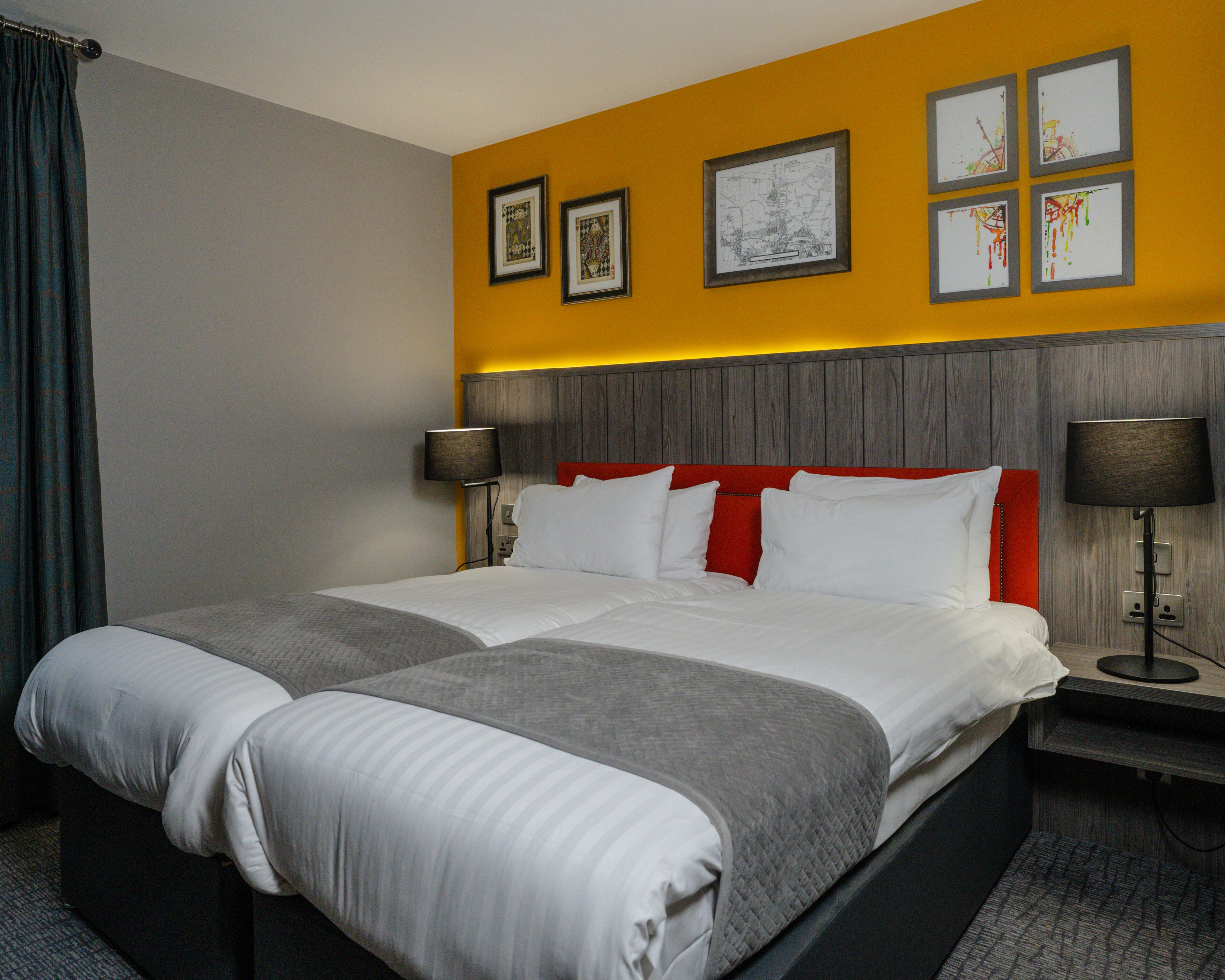 deluxe twin room | in-room safe, individually decorated, desk, laptop workspace