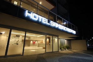 Hotel Samba's contemporary design features a glass entrance and a clear view of the interior.