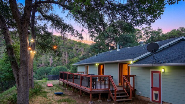 A house with a deck, a satellite dish, and a red door. - The Retreat@Lakeside Hot Tub/Views/Fast WiFi Near Yosemite! (Mariposa)