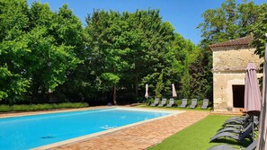 Seasonal outdoor pool, a heated pool, pool umbrellas, pool loungers