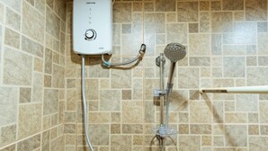 A shower with a control panel and a handheld showerhead. - RedDoorz Plus near Osmena Highway 2 - Quarantine Hotel (Manila)