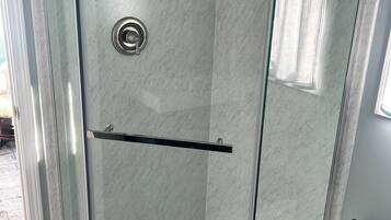 Combined shower/tub, hair dryer, towels, soap