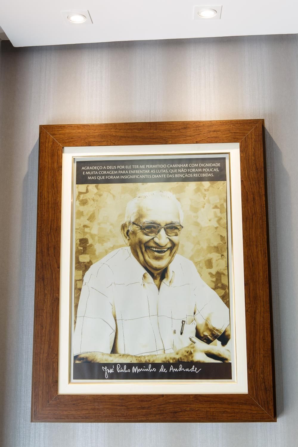 A framed portrait of Jose Pinheiro Marinho de Andrade with a quote.