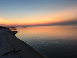 Experience the tranquility of a serene beach with gentle waves lapping at the shore.