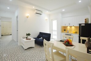 Premium One-Bedroom With Outside-View Balcony | Private kitchen | Full-size fridge, microwave, stovetop, rice cooker