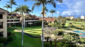 A resort with a pool, palm trees, and a well-maintained lawn. - Family Vacation Home - Ocean Views - Walk to Beach - Sleeps 7 - Hosted by Owner (Lahaina)