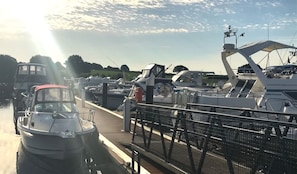 A marina with boats docked, a pedestrian walkway, and a clear sky. - Courtyard Bedroom Ensuite, The Orchard, Terryglass (Nenagh)