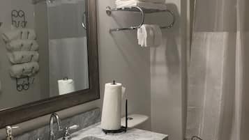 Combined shower/tub, hair dryer, towels, soap