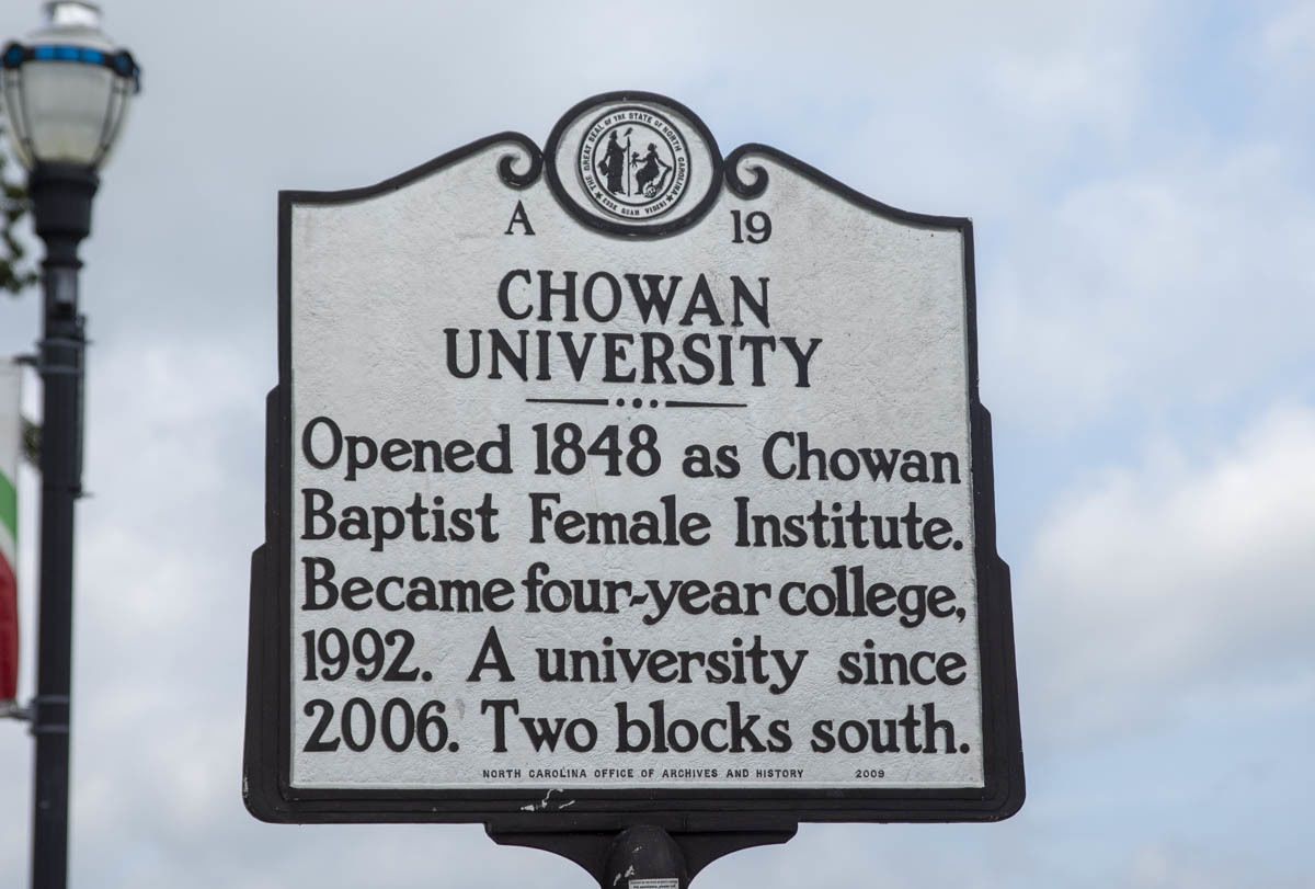 A sign for Chowan University, detailing its history and location.