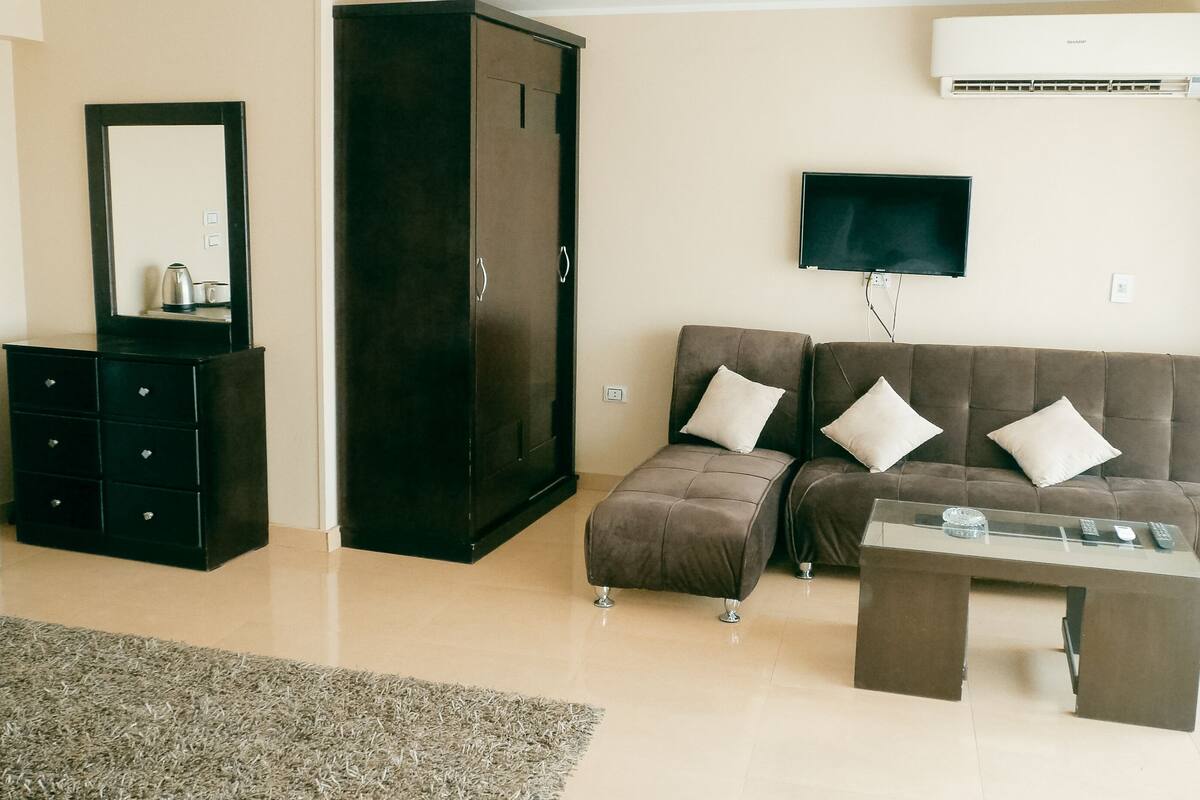 luxury room, multiple beds, non smoking, balcony | living area | flat-screen tv, fireplace