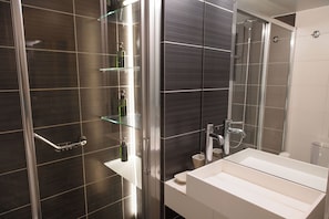 Shower, hair dryer, towels, soap