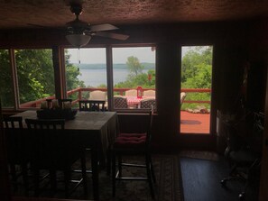 View of the back deck from the dining area. Dining table seats 8.