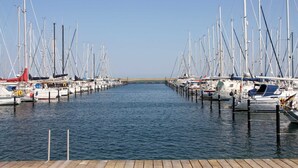 A marina with numerous boats docked at wooden piers. - Baltic Sea Apartment App. 6110 - Baltic Sea app. App. 6110 (Wendtorf)