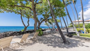 On the beach, sun loungers, beach towels