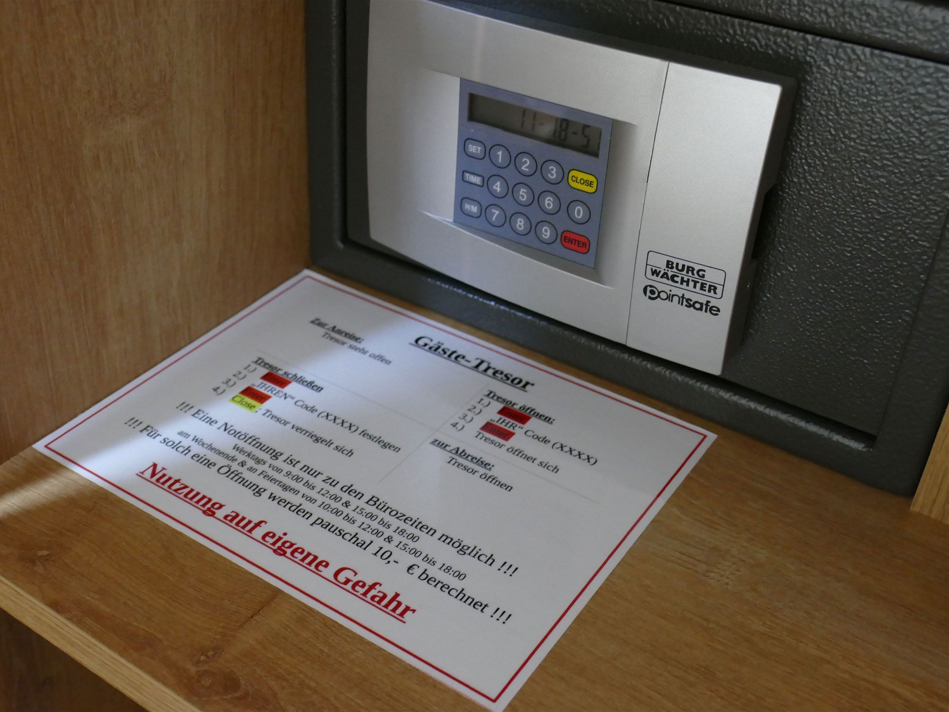 A ticket machine with a keypad and a paper ticket dispenser.