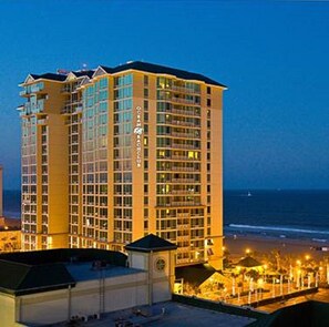 Guests can enjoy ocean views from balconies at this beachfront hotel.