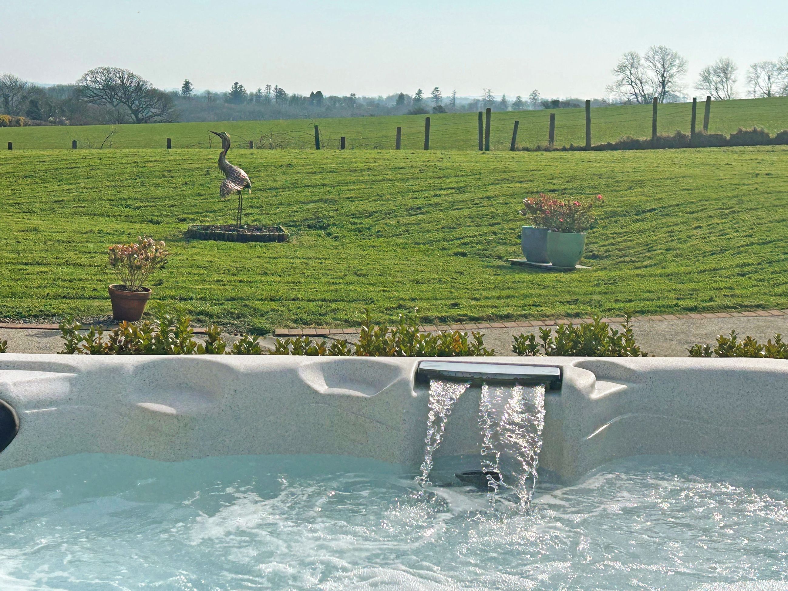 Take in the fabulous views from our private hot tub | Manor Lodge Stables, Wiston, near Haverfordwest