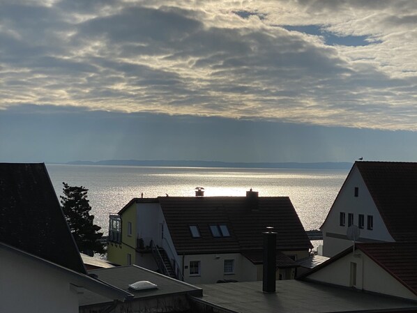 A coastal view with buildings and a body of water.