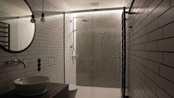 Shower, hair dryer, towels, toilet paper