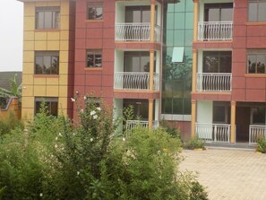 Stylish residential building with balconies and a courtyard.