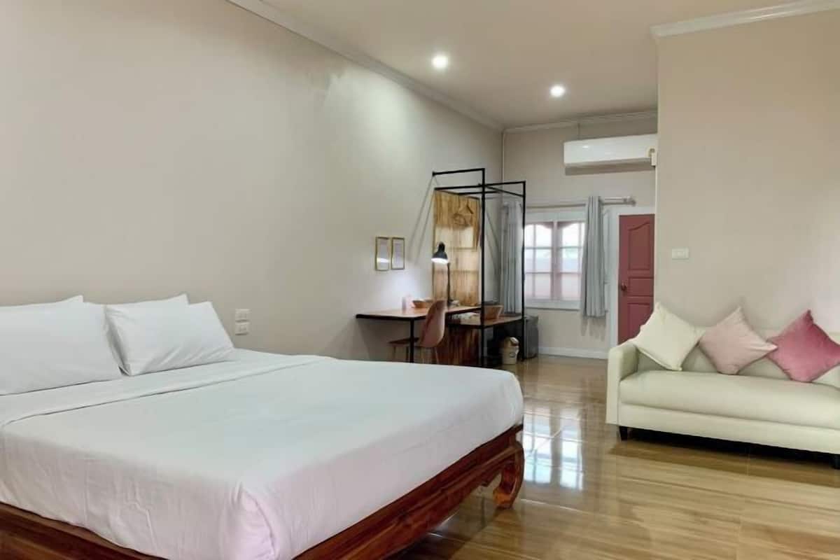 Premium bedding, desk, laptop workspace, blackout drapes