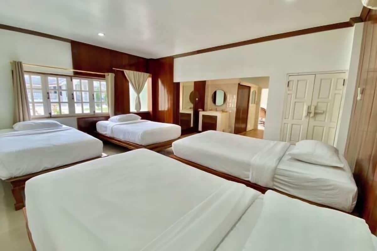 Premium bedding, desk, laptop workspace, blackout drapes