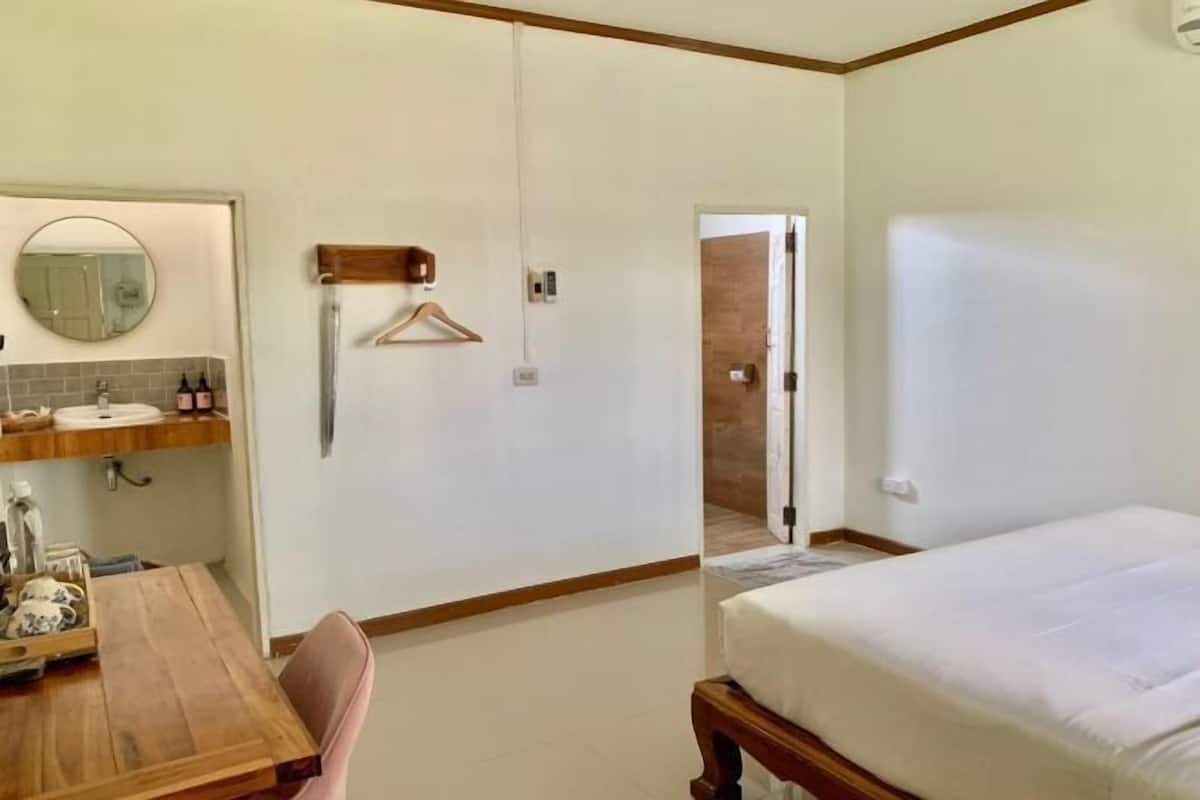 Premium bedding, desk, laptop workspace, blackout drapes