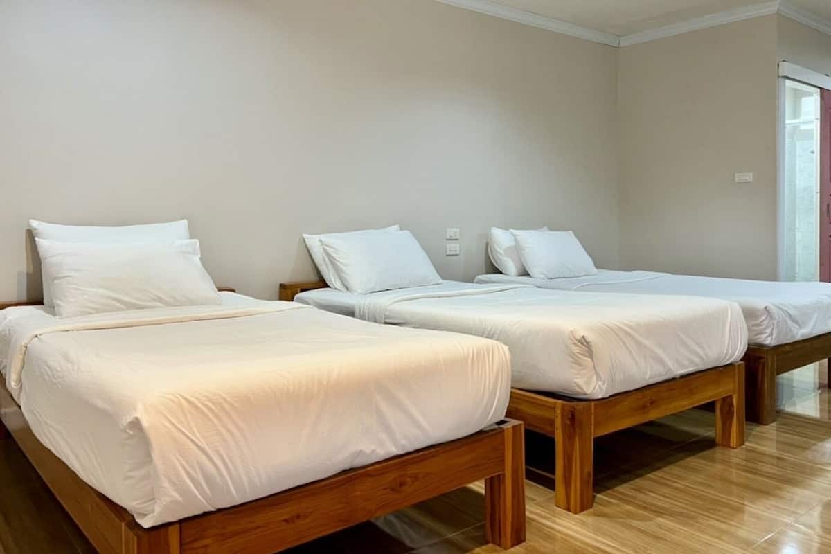 Premium bedding, desk, laptop workspace, blackout drapes