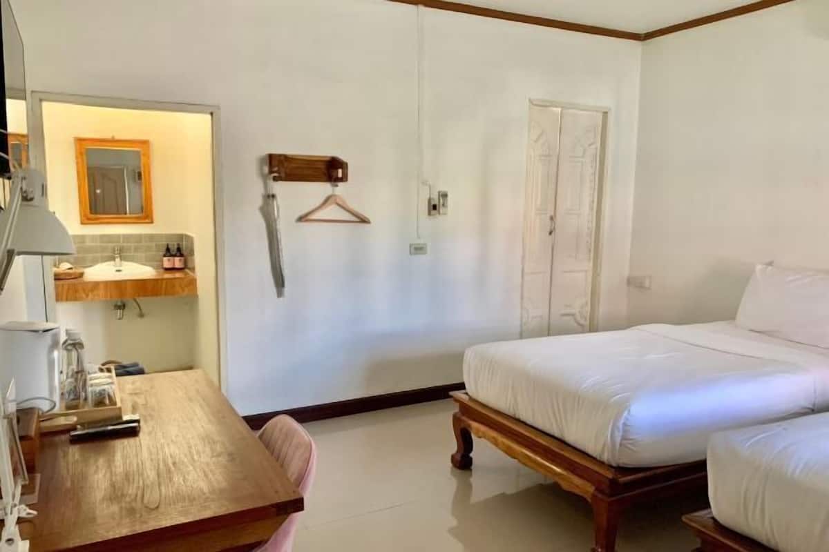 Premium bedding, desk, laptop workspace, blackout drapes