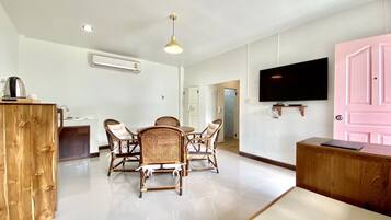 Deluxe Room, Multiple Beds | Living area | 32-inch LED TV with satellite channels