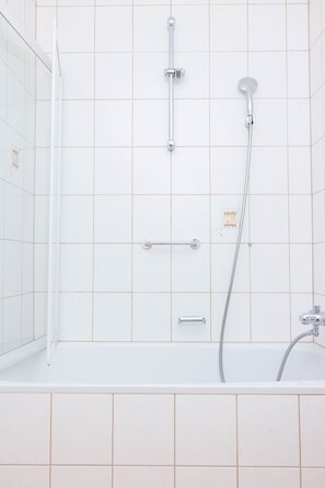 Shower, hair dryer, towels, toilet paper
