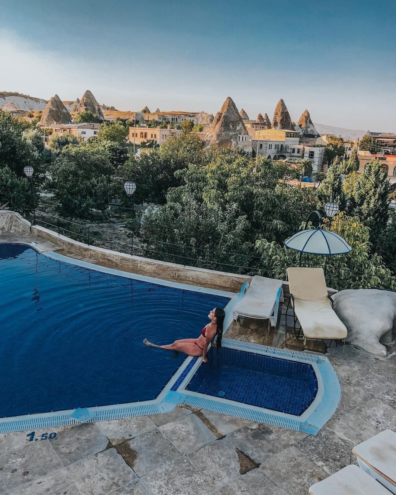 Seasonal outdoor pool, open 9:00 AM to 7:00 PM, pool umbrellas