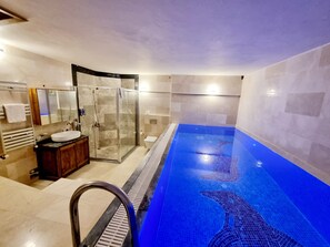 Seasonal outdoor pool, open 10:00 AM to 7:00 PM, pool umbrellas - Cappadocia Caves Hotel (Nevsehir)