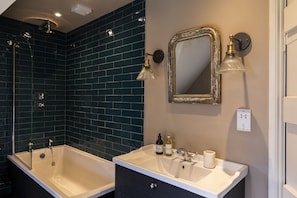 Combined shower/tub, hair dryer, towels, soap