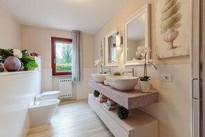 Bathtub, hair dryer, towels
